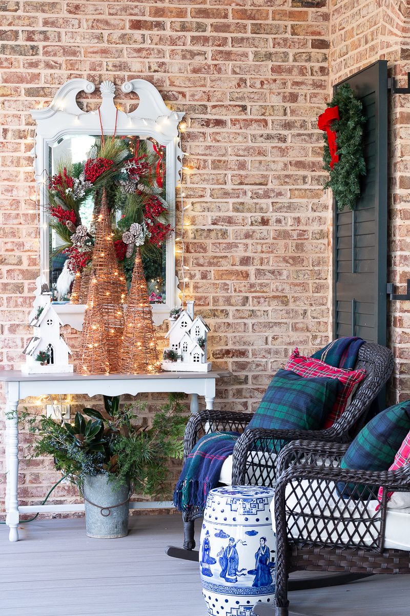 Cozy Rustic Porch Seating with Plaid Blankets and Lighted Trees — Christmas Porch Decor