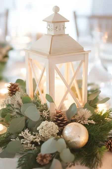 White Lantern with Pine, Eucalyptus, and Gold Bauble Accents White Lantern with Pine, Eucalyptus, and Gold Bauble Accents — Christmas Wedding Centerpiece
