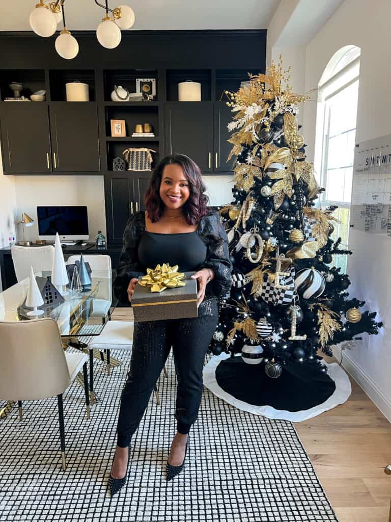 Modern Black Christmas Tree with Gold Ornaments and a Human Touch Modern Black Christmas Tree with Gold Ornaments and a Human Touch — Black and Gold Christmas Tree