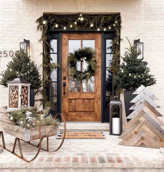 Farmhouse Porch with Wooden Sled and Evergreen Garlands — Farmhouse Christmas Porch