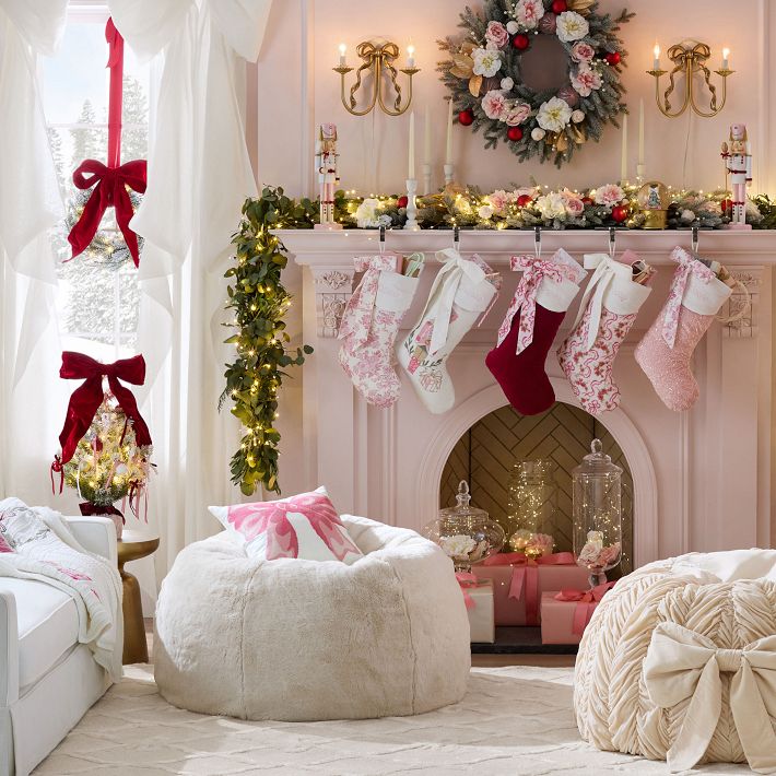 Glamorous Pink Mantelpiece Decorated with Festive Stockings and Wreath Glamorous Pink Mantelpiece Decorated with Festive Stockings and Wreath — Pink Christmas Decor