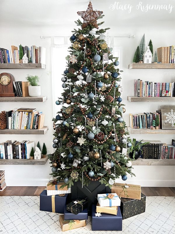 Modern Living Room with Central Christmas Tree and Bookshelves — Winter Wonderland Christmas Decor