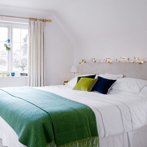 Minimalist Bedroom with Upholstered Headboard and Subtle Fairy Lights — Christmas Fairy Lights Headboard
