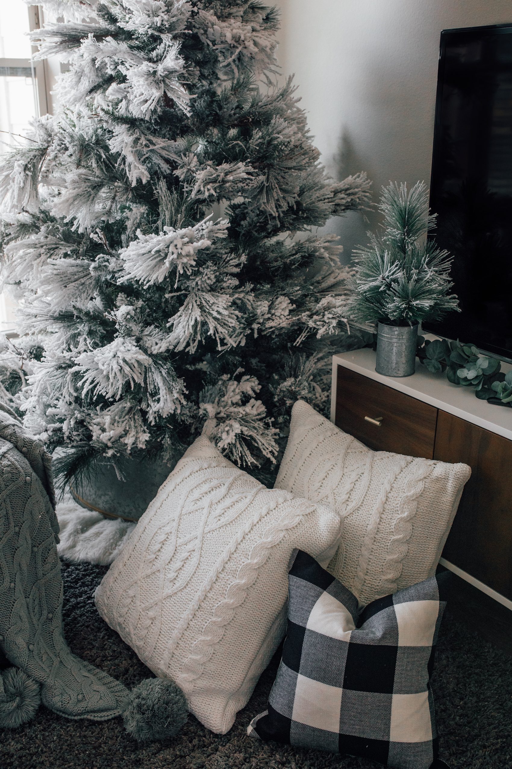 Cozy Flocked Tree Vignette with Knit and Buffalo Check Pillows — Flocked Christmas Tree Decor