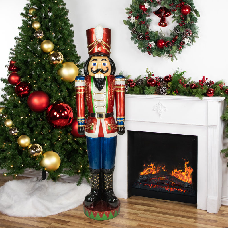 Large Red and Blue Nutcracker by Fireplace and Christmas Tree Large Red and Blue Nutcracker by Fireplace and Christmas Tree — Nutcracker Christmas Tree
