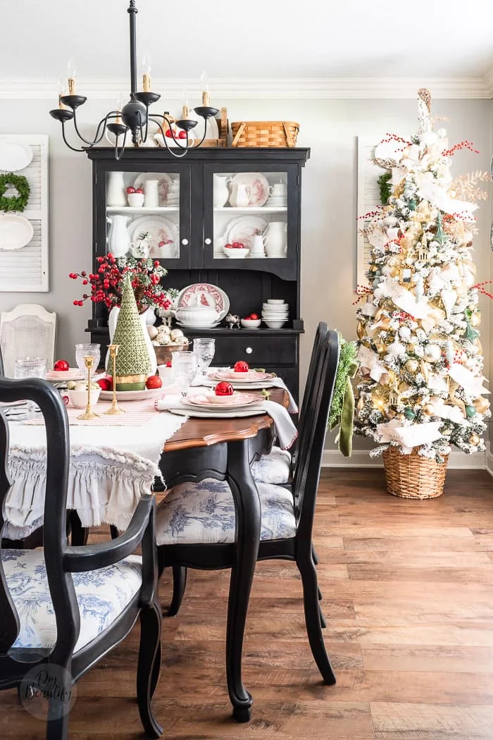 Farmhouse Dining Room with Black Hutch and Red Accents — Christmas Dining Room Decor