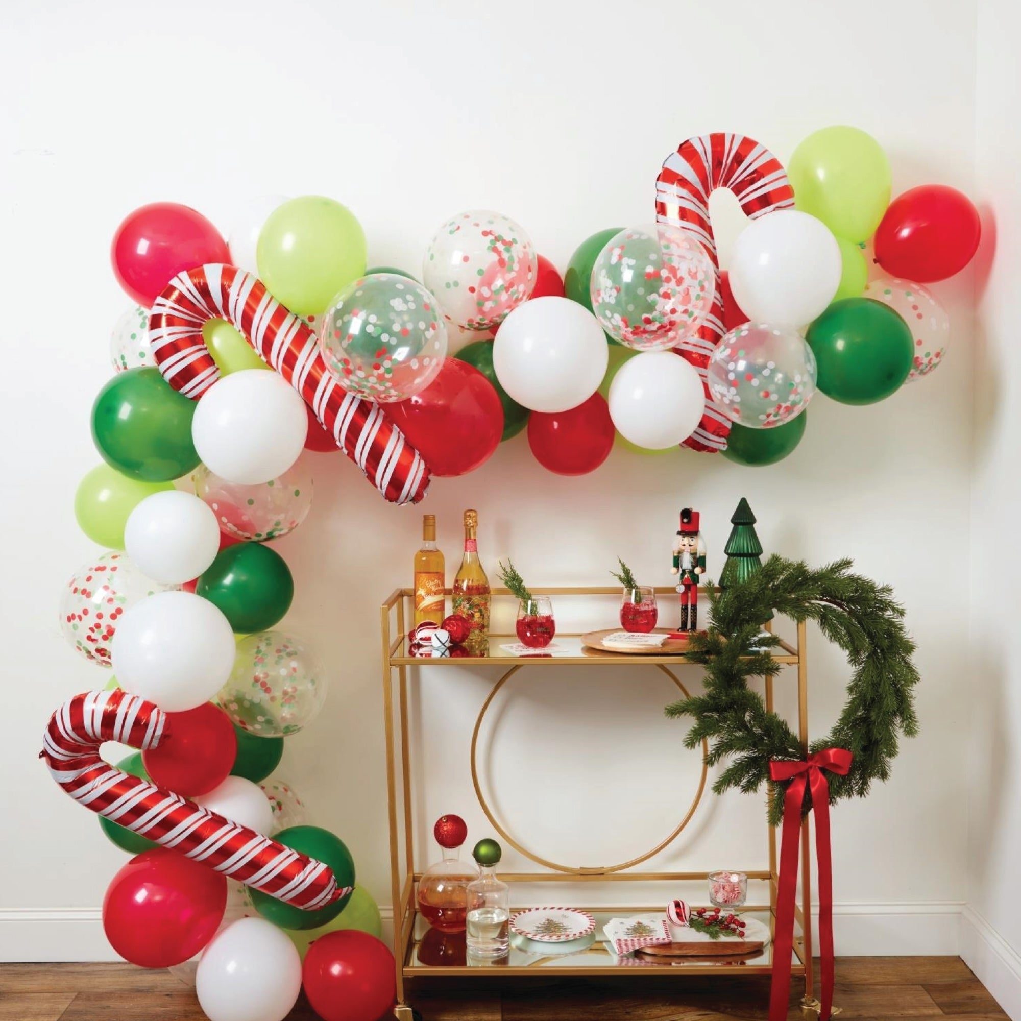 Holiday Garland Draped Over a Gold Bar Cart — Christmas Balloon Garland