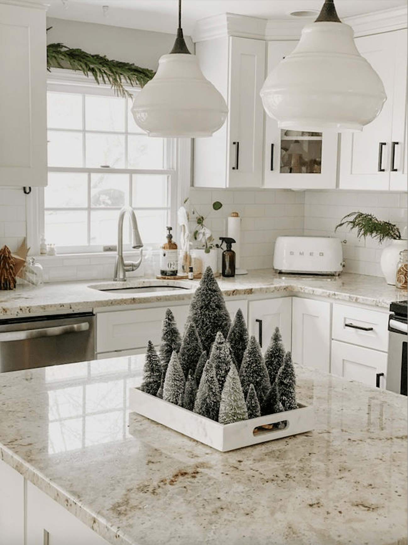 Modern Kitchen Island Adorned with Miniature Green Trees Modern Kitchen Island Adorned with Miniature Green Trees — Christmas Kitchen Decor