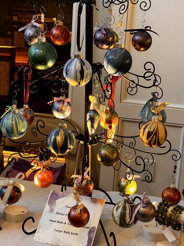 Tree Stand With Multiple Branches Black Wrought Iron Ornament Tree with a Variety of Colorful Baubles Tree Stand With Multiple Branches Black Wrought Iron Ornament Tree with a Variety of Colorful Baubles — Ornament Christmas Tr