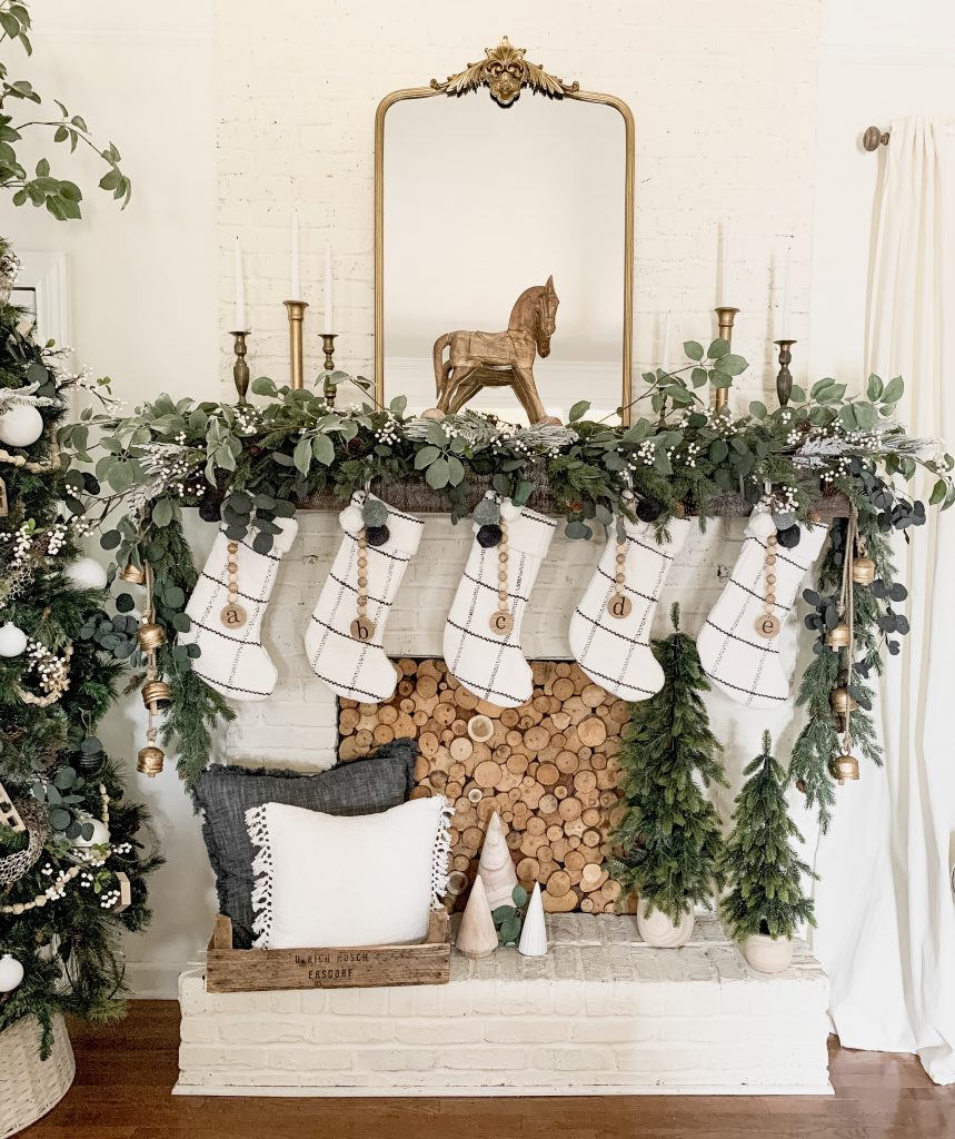 Farmhouse Mantel with Plaid Stockings and Vintage Mirror — Christmas Mantel Decor