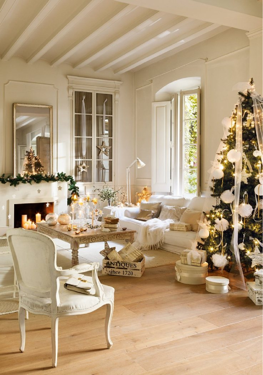 Seating Area Elegant Living Room with a Soft White Christmas Tree and Fireplace Seating Area Elegant Living Room with a Soft White Christmas Tree and Fireplace — White Christmas Decor