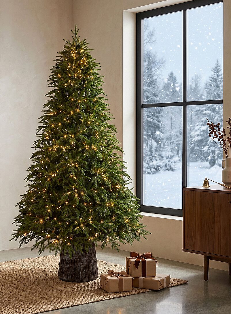Warm White Lights on a Large Artificial Tree in a Modern Living Room Warm White Lights on a Large Artificial Tree in a Modern Living Room — Christmas Tree Lights