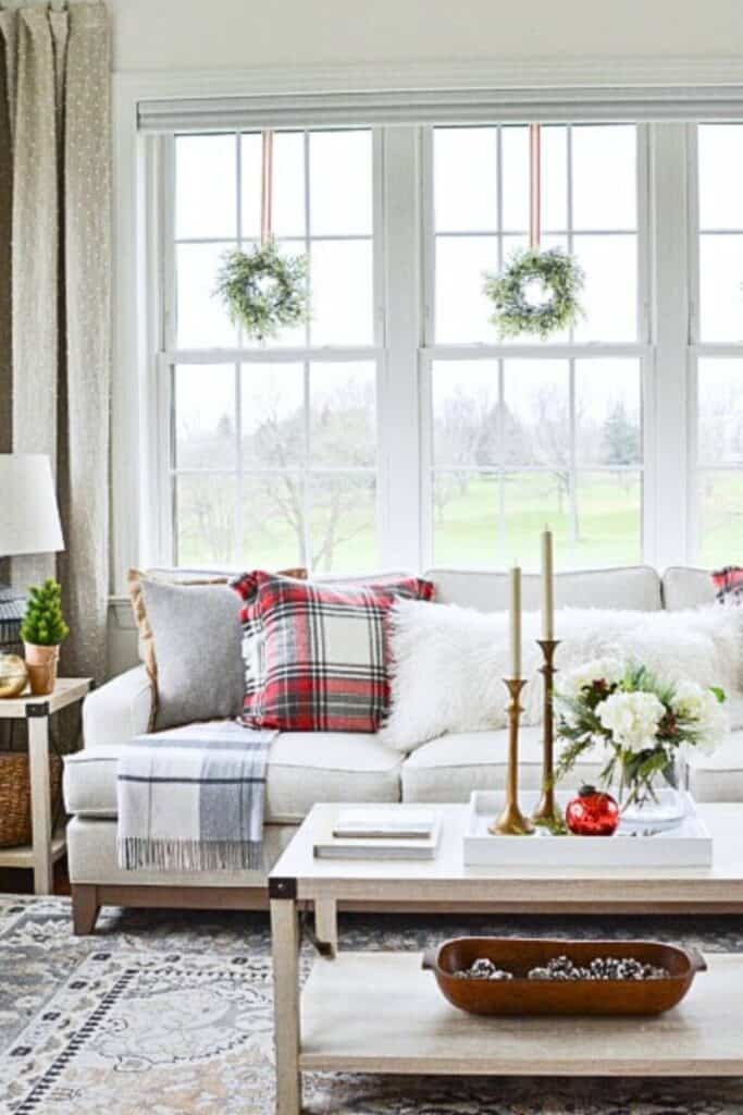 Traditional Living Room with Wreaths on Large Window Panes — Christmas Living Room Decor