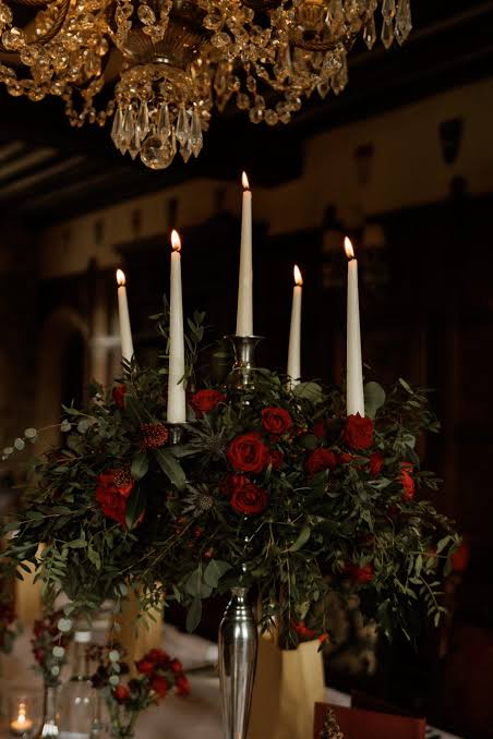 Dramatic Silver Candelabra with Red Roses and Greenery Dramatic Silver Candelabra with Red Roses and Greenery — Christmas Wedding Centerpiece