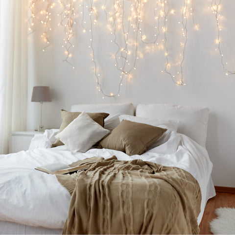 Bed Centered Modern Bedroom with Cascading Fairy Lights Above Bed — Christmas Fairy Lights Headboard