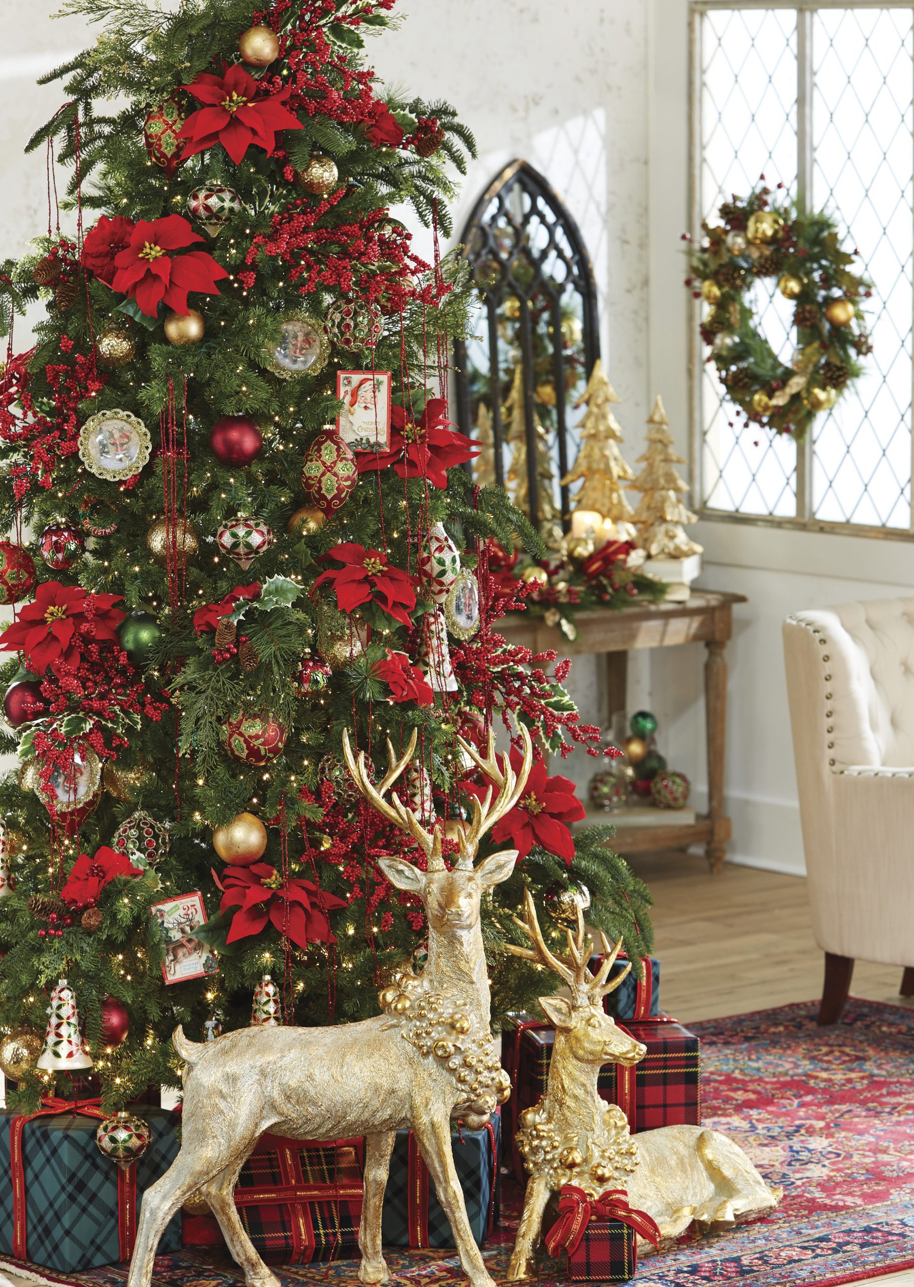 Festive Christmas Tree with Gold Reindeer Accents — Red and Gold Christmas Tree