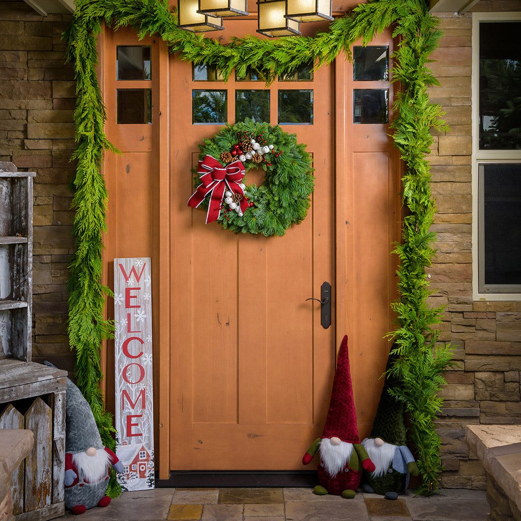 Rustic Cedar Garland Framing a Front Door Rustic Cedar Garland Framing a Front Door — Christmas Garland