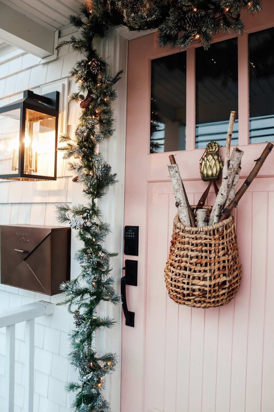 Modern Farmhouse Porch with Pink Door and Garland — Christmas House Exterior Decor