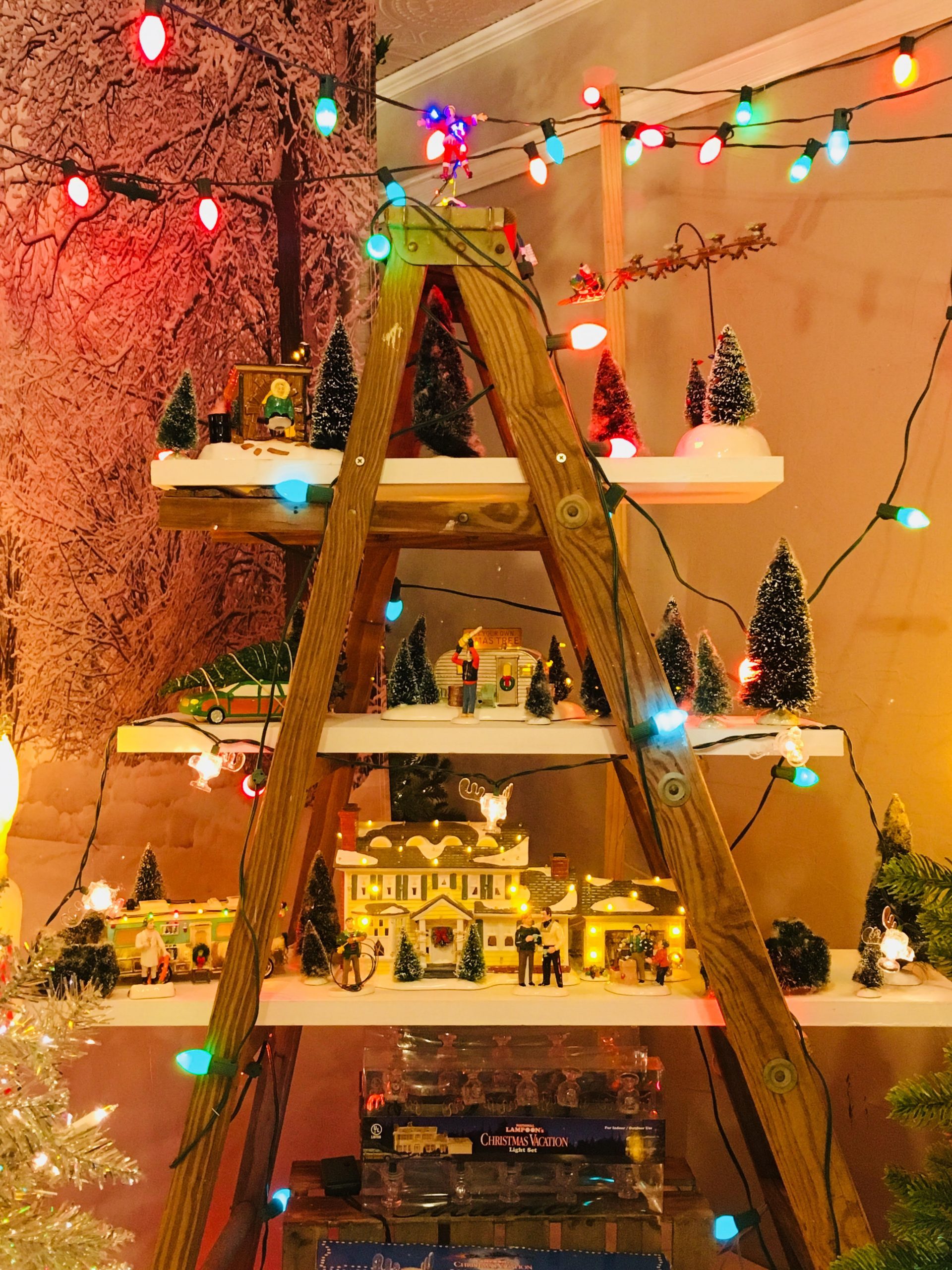 Miniature Christmas Village on Wooden Ladder Shelves Miniature Christmas Village on Wooden Ladder Shelves — Christmas Light Display Ideas