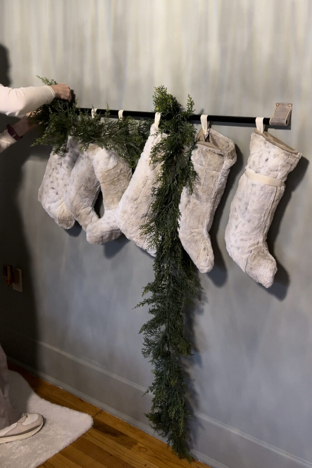 Textured Stockings on a Rod with Cedar Garland — Christmas Stockings Display