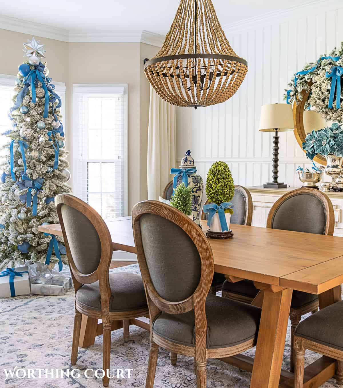 Elegant Dining Room with Flocked Tree and Blue Accents — Blue Christmas Decor
