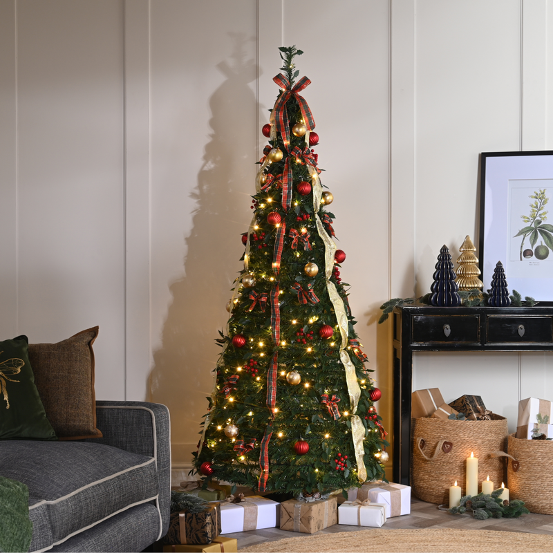 Wide Room Shot Tall Red and Gold Christmas Tree in a Living Space