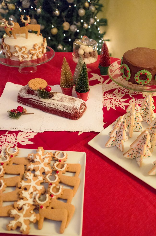 Traditional Yule Log Centerpiece on a Festive Dessert Table Traditional Yule Log Centerpiece on a Festive Dessert Table — Christmas Dessert Table