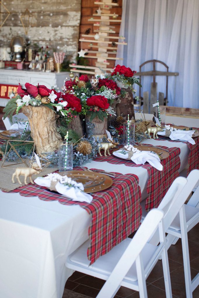Rustic Modern Table with Log Centerpieces and Gold Reindeer — Christmas Party Decor