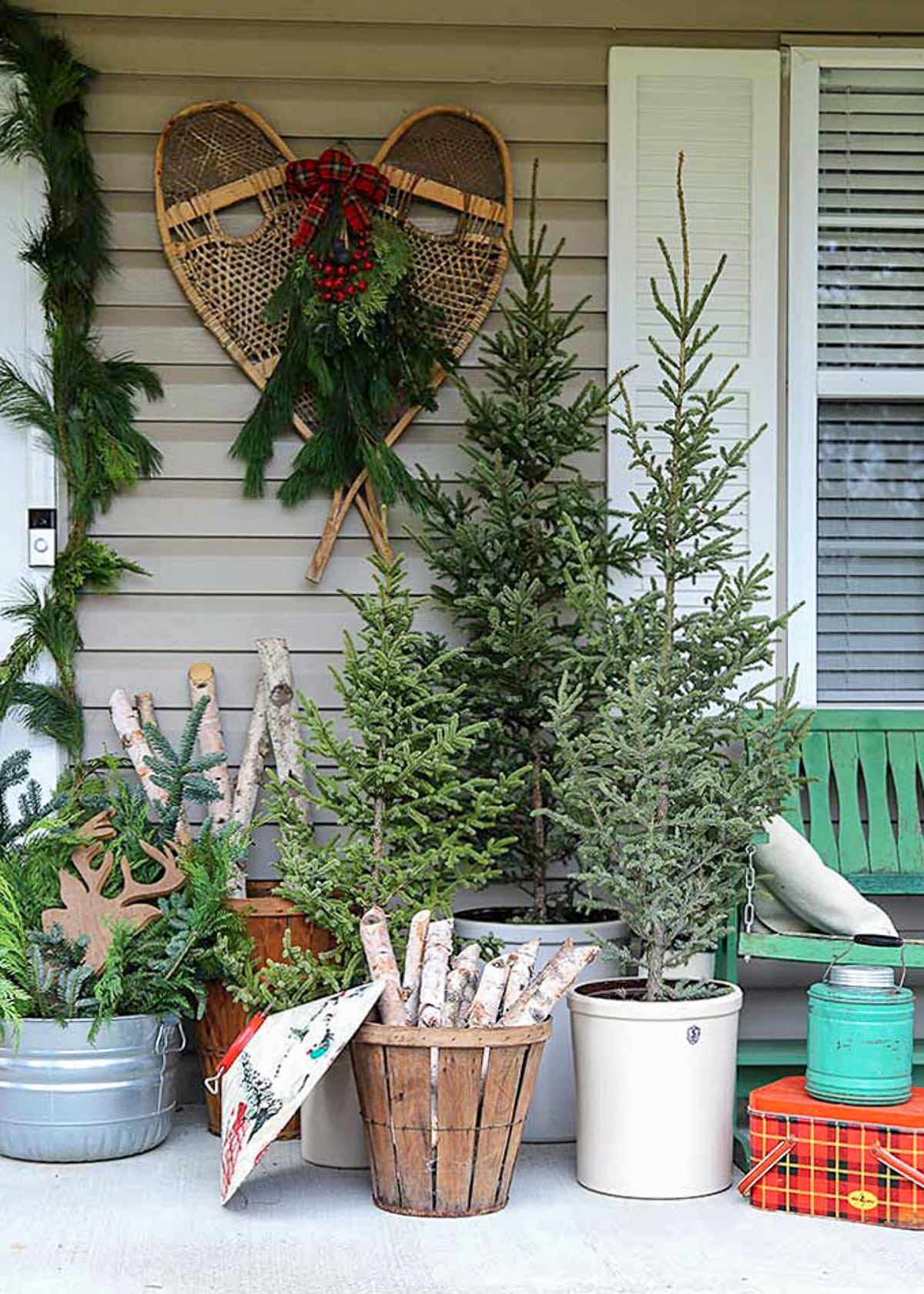 Rustic Porch with Miniature Christmas Trees and Snowshoes — Vintage Christmas Decor