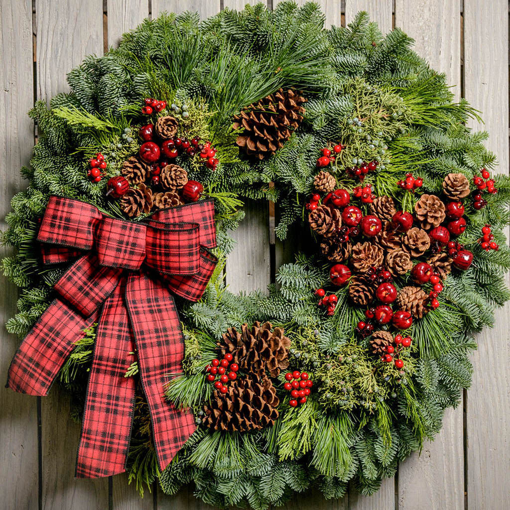 Dense Fir Wreath with Plaid Bow on Weathered Wood Dense Fir Wreath with Plaid Bow on Weathered Wood — Christmas Wreath
