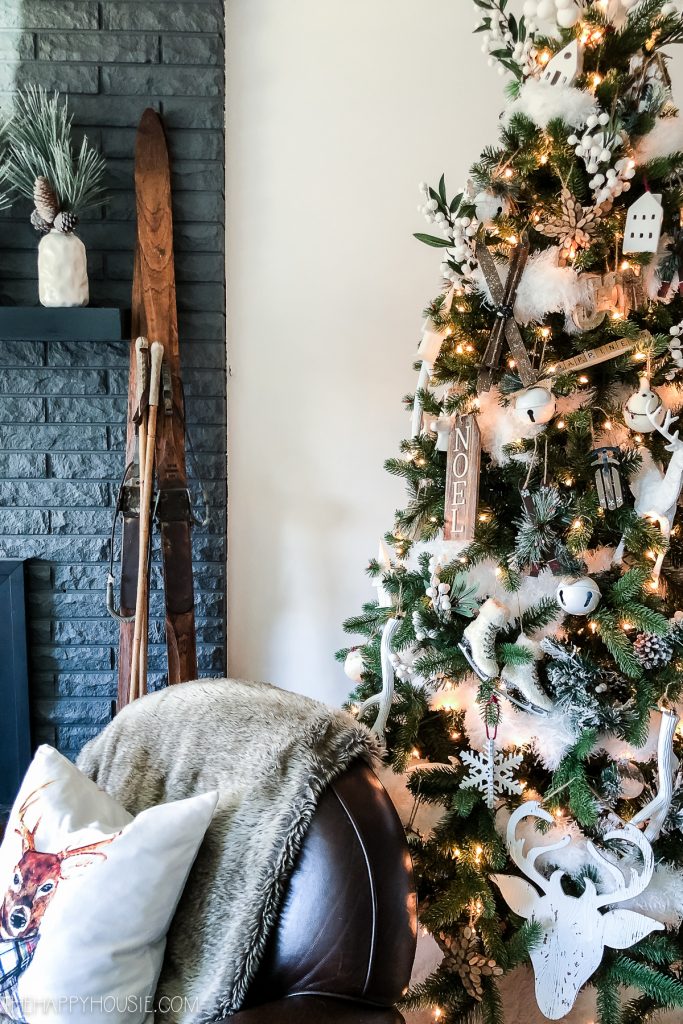 Farmhouse Living Room Corner with Rustic Christmas Tree and Skis Farmhouse Living Room Corner with Rustic Christmas Tree and Skis — Farmhouse Christmas Decor
