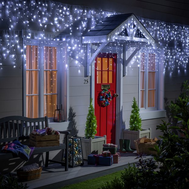 Icicle Lights Framing a Festive Porch with Red Door — Icicle Christmas Lights
