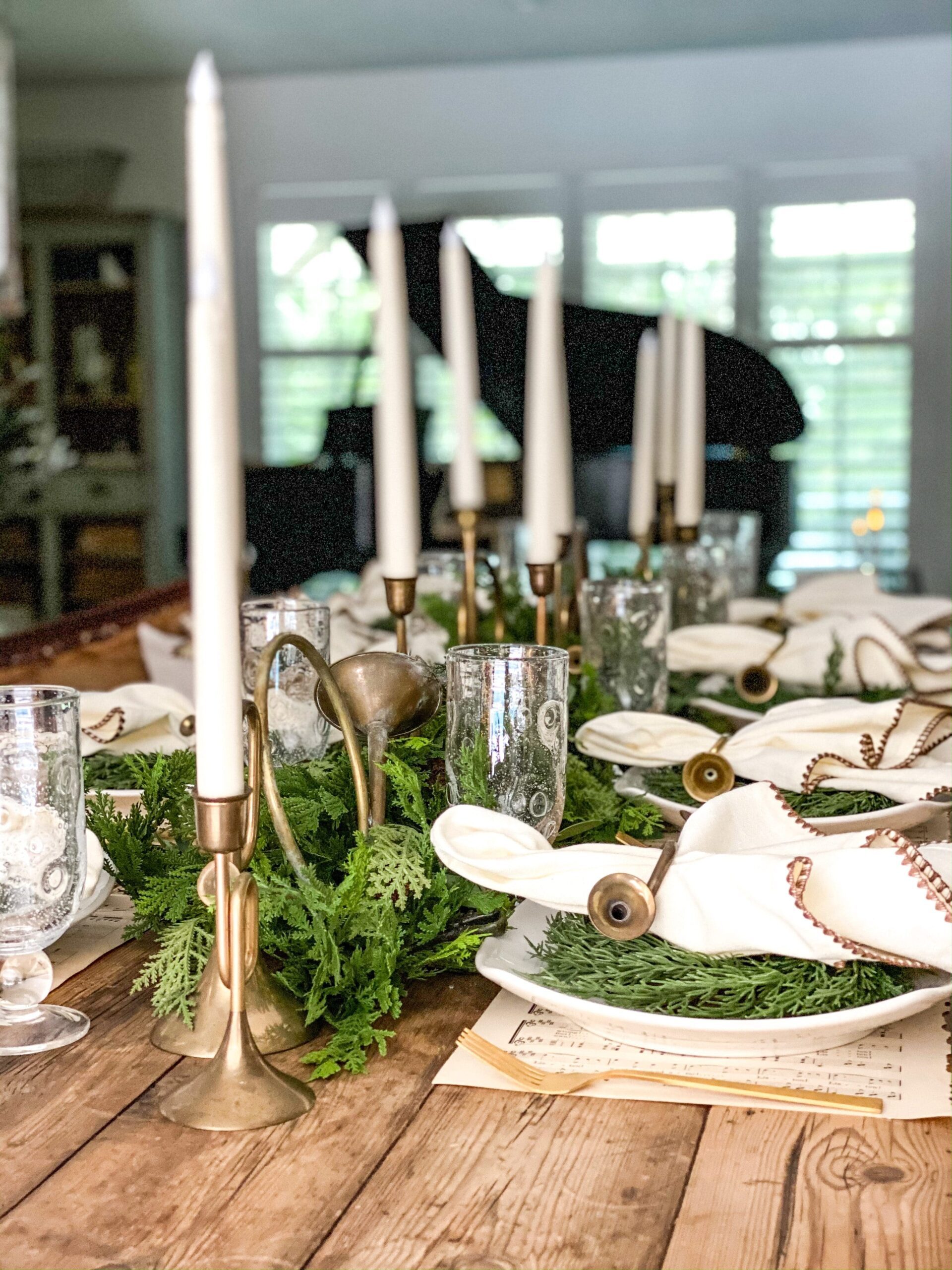Elegant Rustic Table with Brass Candle Holders and Greenery — Christmas Table Setting