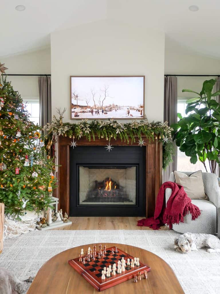 Medium Shot Focus On Fireplace Modern Rustic Living Room with Fireplace and Christmas Tree — Cozy Christmas Decor