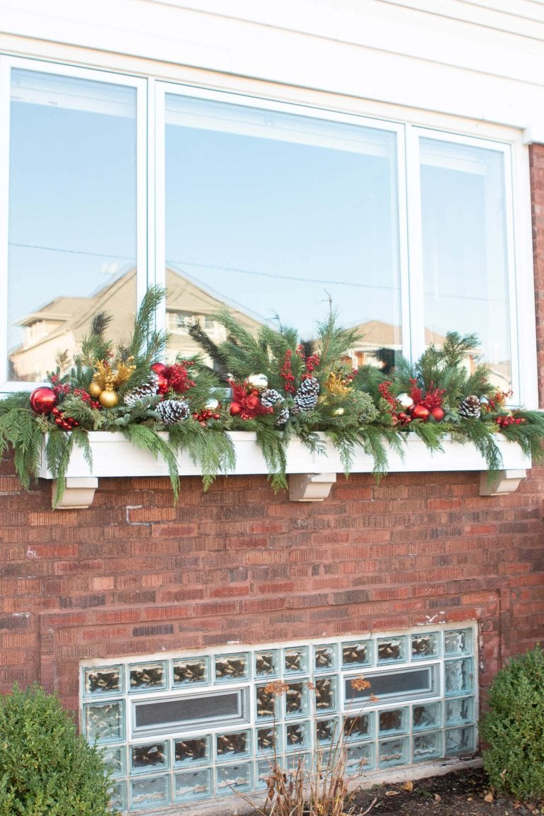 Densely Packed Window Box with Greenery, Pinecones, and Red and Gold Ornaments — Christmas Window Decor Outdoor