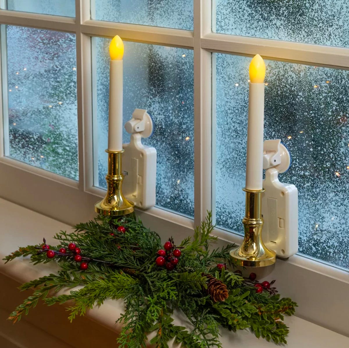 White LED Candles with Gold Bases and Evergreen Garland — Christmas Window Candles