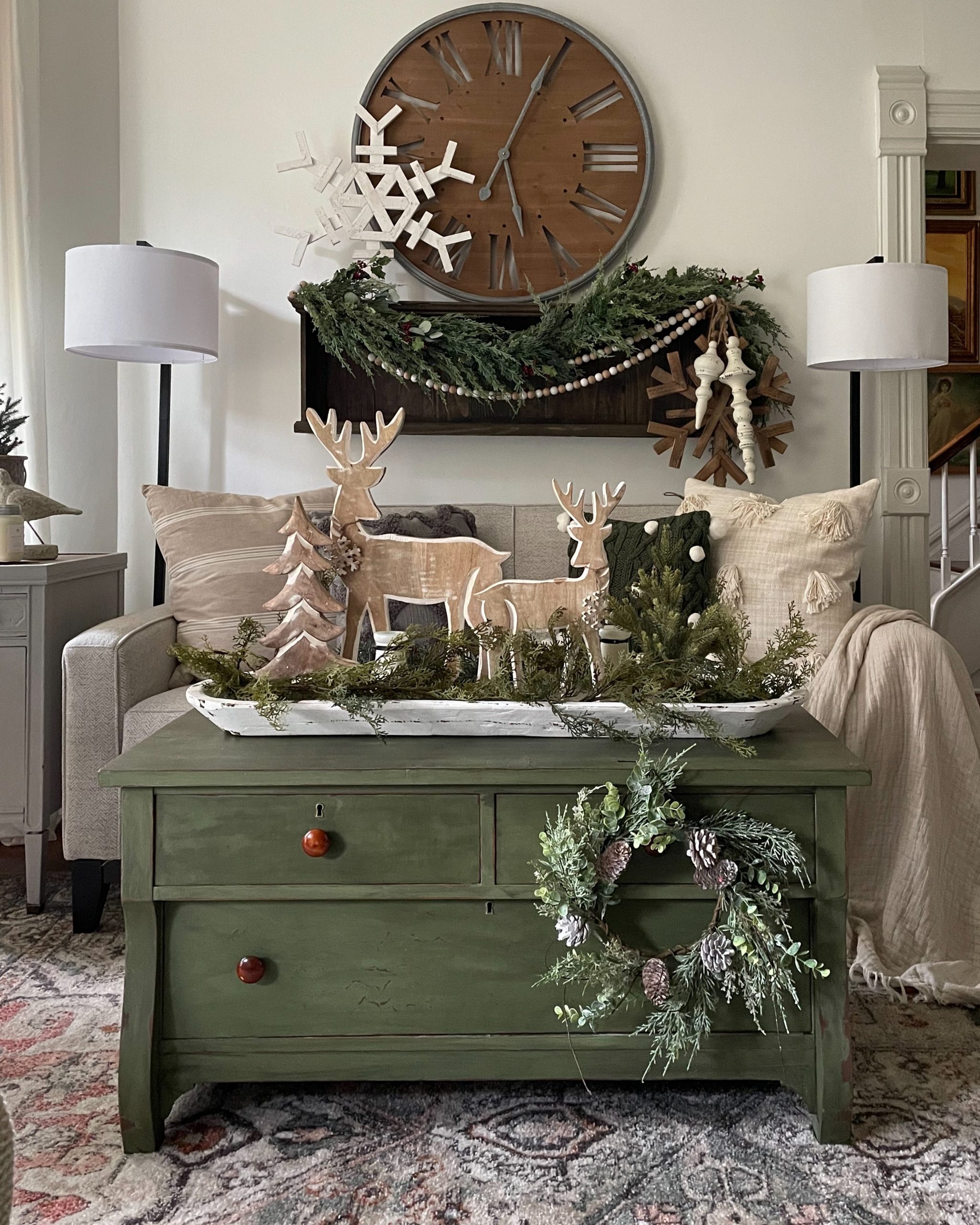 Green Dresser with Wooden Deer and Pine Garland Vignette — Rustic Christmas Decor