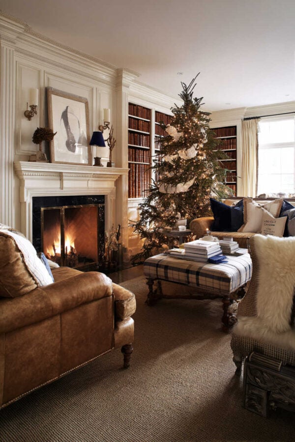 Classic Living Room with Leather Sofas and Bookshelves Flanking the Fireplace — Christmas Living Room Decor