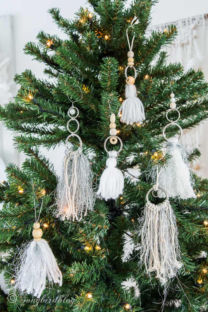 Close-Up Detail Handmade Boho Yarn Tassel Ornaments on a Christmas Tree — Boho Christmas Decor