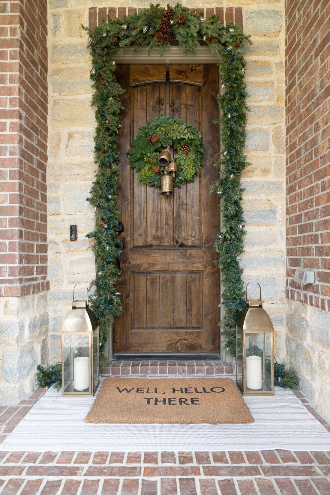 Rustic Wooden Door with Garland and Bell Wreath — Christmas Porch Decor