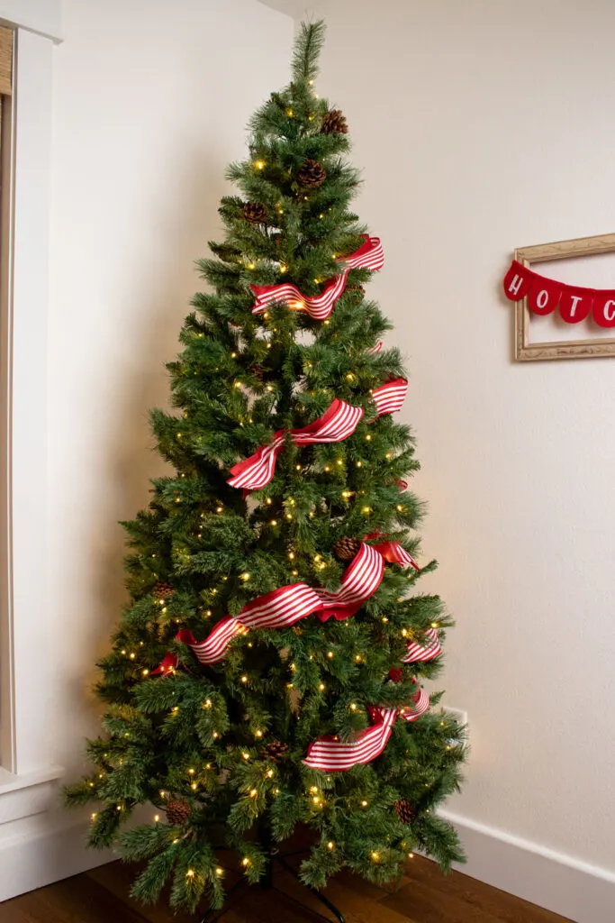 Corner Of A Room Slender Christmas Tree with Classic Red and White Striped Ribbon — Vertical Ribbon Christmas Tree