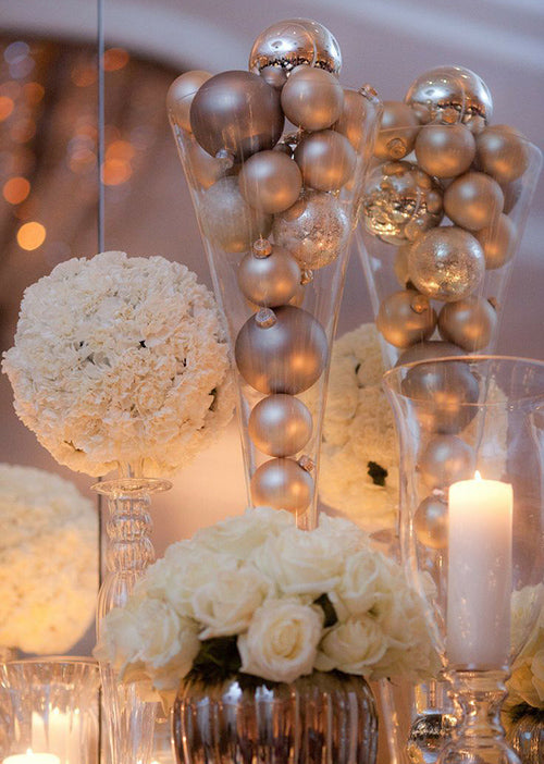 Varied Centerpiece Styles: Ornaments in Glass and Log Slices Varied Centerpiece Styles: Ornaments in Glass and Log Slices — Christmas Wedding Centerpiece