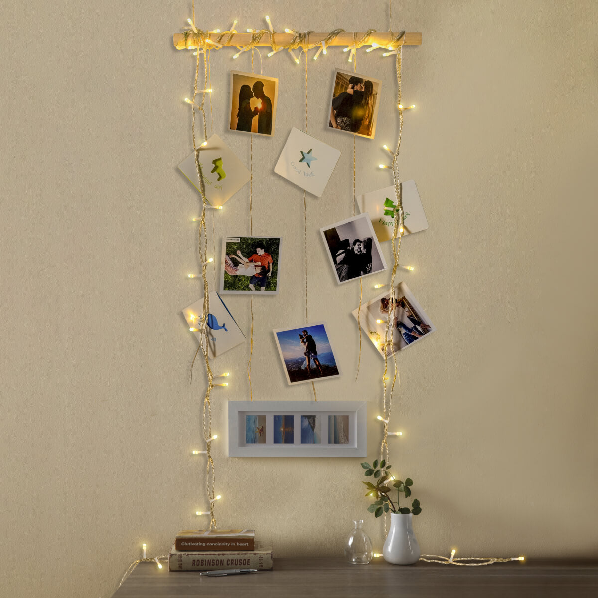 Fairy Lights and Photos Intertwined on a Wooden Rod Fairy Lights and Photos Intertwined on a Wooden Rod — Christmas Fairy Lights Wall