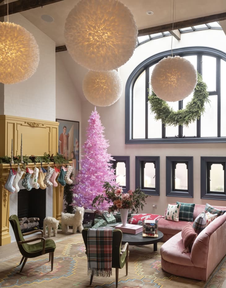 Spacious Eclectic Living Room with a Vibrant Pink Christmas Tree and Yellow Fireplace Spacious Eclectic Living Room with a Vibrant Pink Christmas Tree and Yellow Fireplace — Pink Christmas Decor