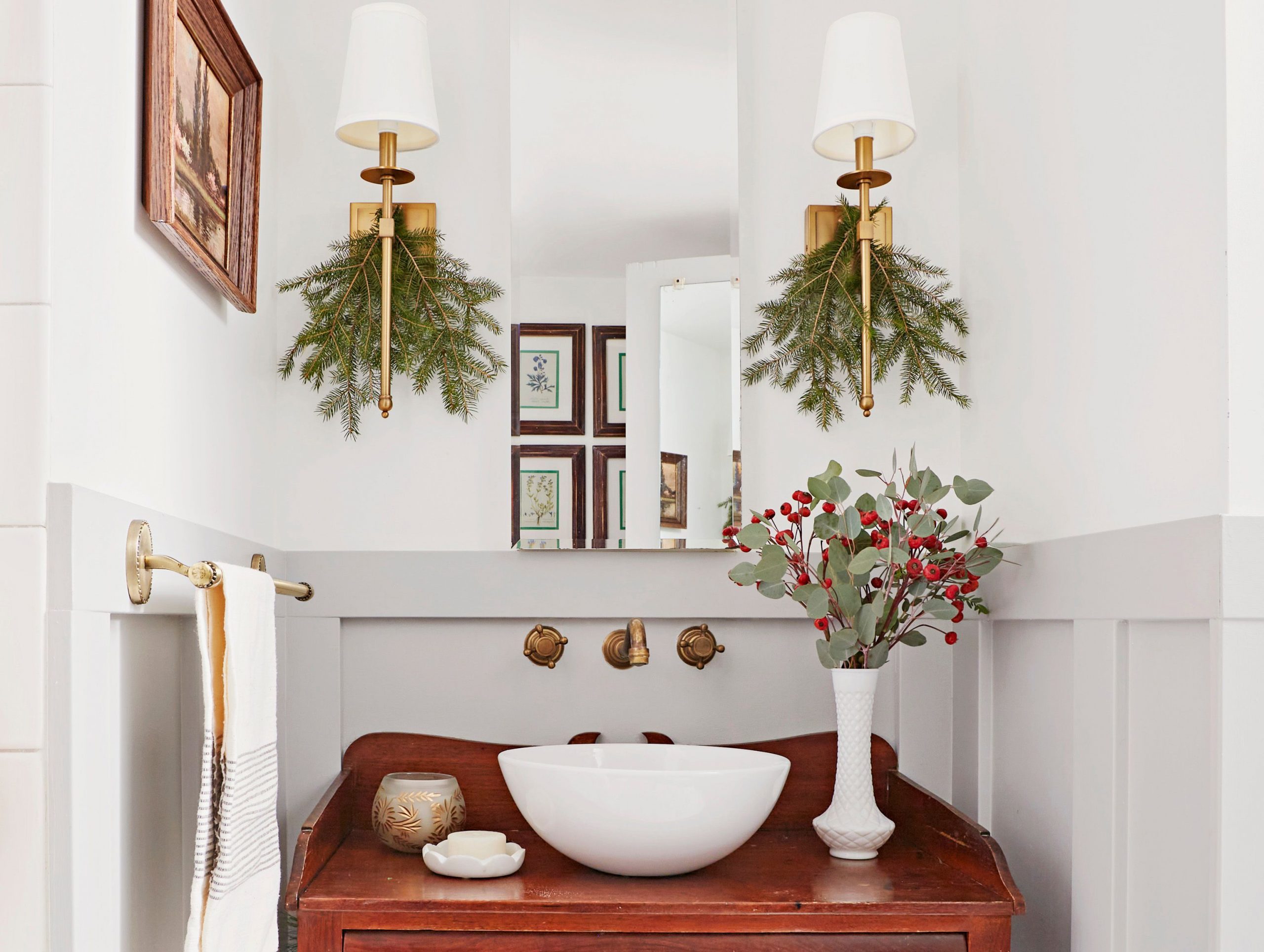 Festive Greenery on Wall Sconces and Berry Vase — Christmas Bathroom Decor