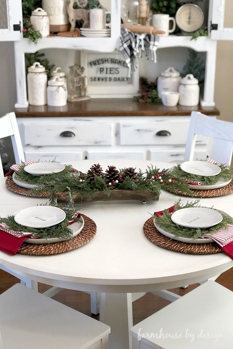 Farmhouse Style Table with Woven Placemats and Pine Garland — Christmas Table Setting