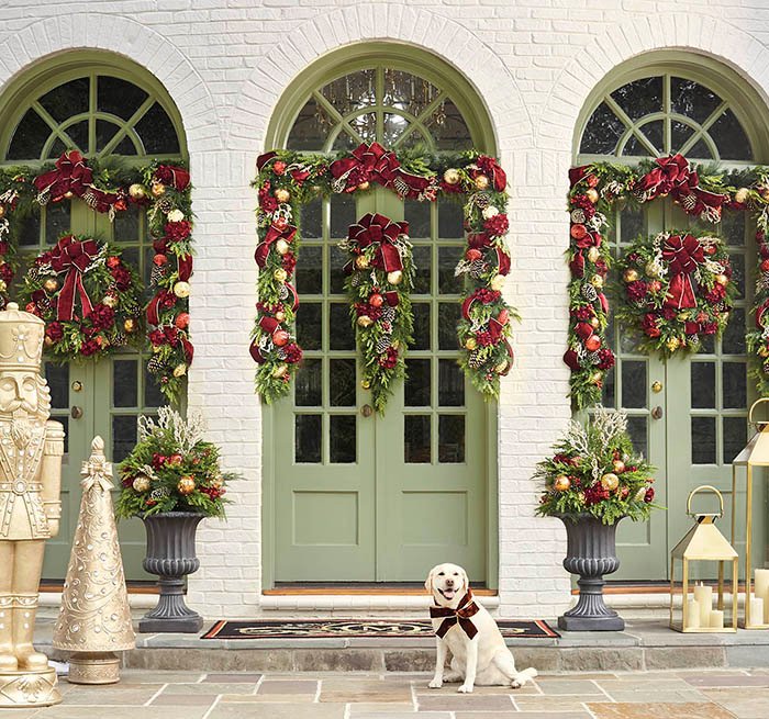Ornate Garlands on Light Green Doors with Nutcracker Figure Ornate Garlands on Light Green Doors with Nutcracker Figure — Christmas Front Door Decor
