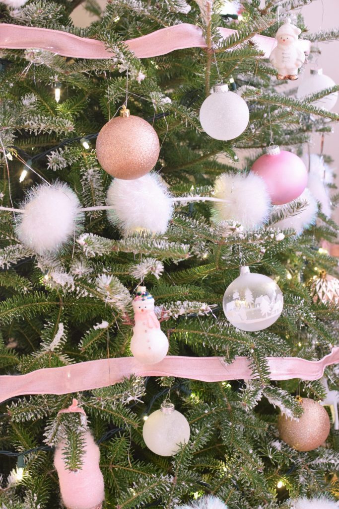 Playful Christmas Tree Decorations Featuring Pink Ribbon and White Pom-Poms Playful Christmas Tree Decorations Featuring Pink Ribbon and White Pom-Poms — Pink Christmas Decor