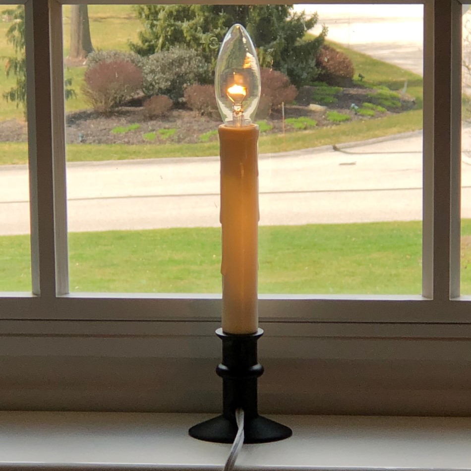 Single Electric Candle on a White Sill — Christmas Window Candles