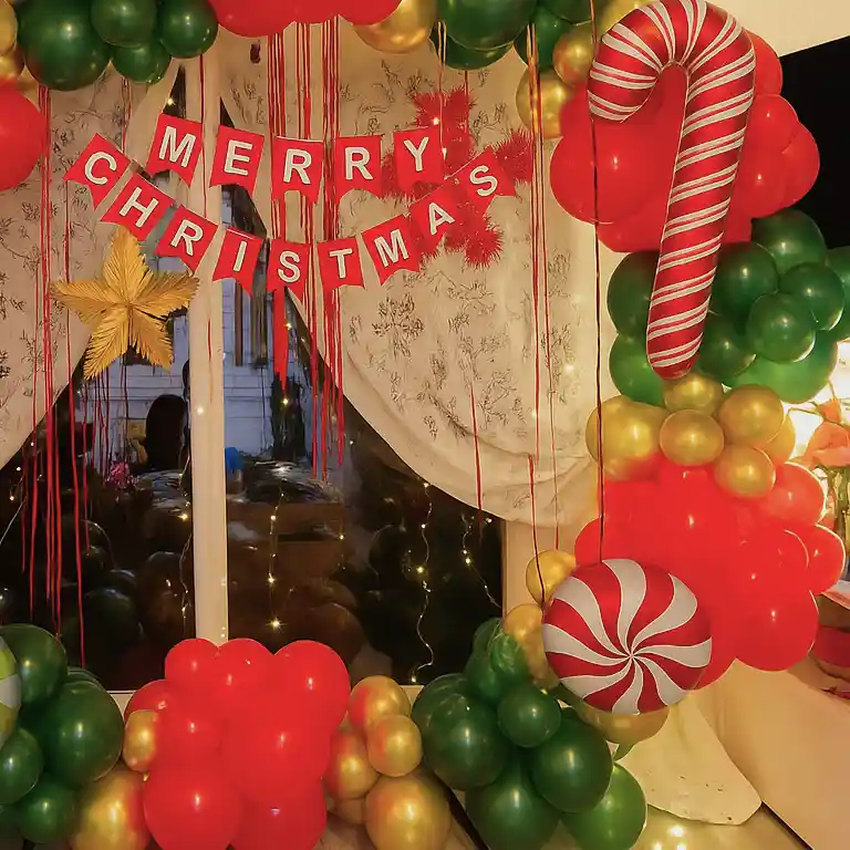 Festive Balloon Arch Framing a Window with 'Merry Christmas' Banner Festive Balloon Arch Framing a Window with 'Merry Christmas' Banner — Christmas Party Backdrop